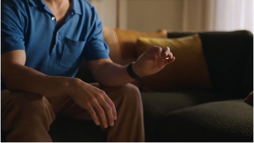 A person tapping their index finger and thumb together to select something on Apple&nbsp;Vision&nbsp;Pro.