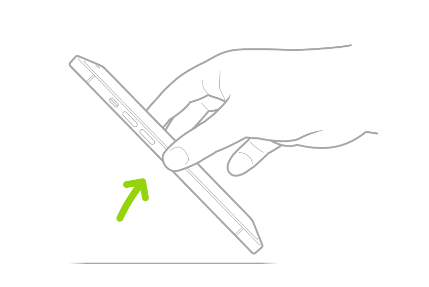 Eine Hand, die ein iPhone von einer flachen Oberfläche hebt.