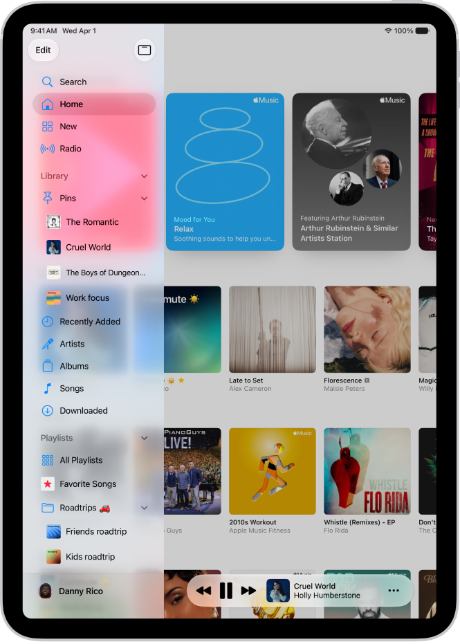 The Music app open on iPad showing the sidebar on the left and albums on the right. The MiniPlayer is at the bottom.