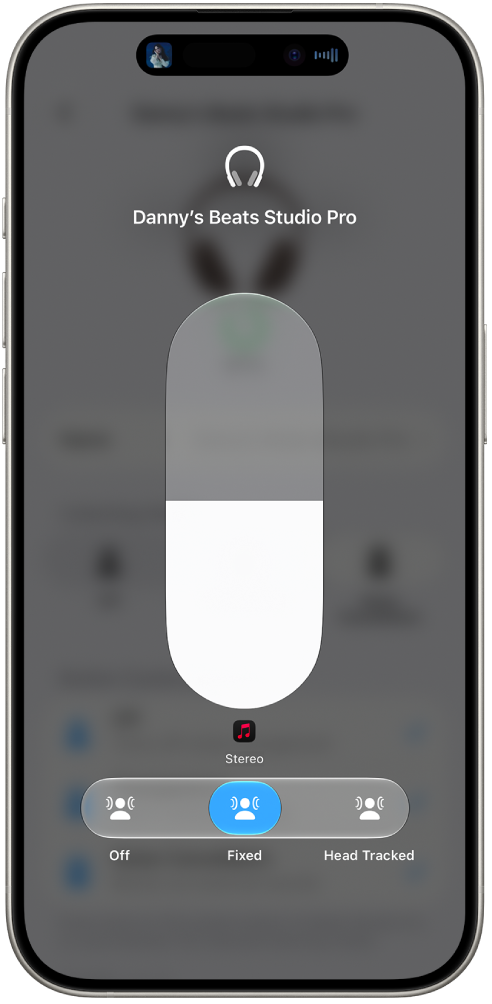 The volume screen in Control Center showing the volume level for Studio Pro headphones. Below the volume indicator, the Spatial Audio options are shown. The options are Off, Fixed, and Head Tracked.