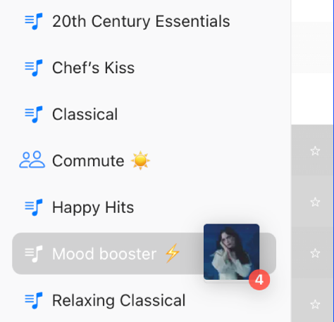 Songs being dragged to a playlist. The playlist is highlighted.