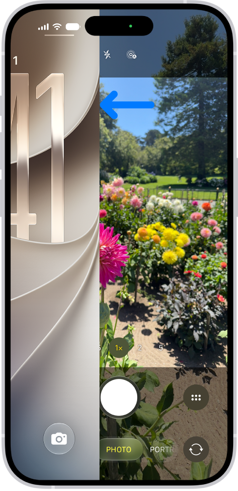 The iPhone screen showing the Lock Screen sliding to the left and the Camera open on the right side of the screen.