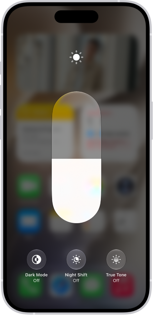 The iPhone Home Screen with Dark Mode on.