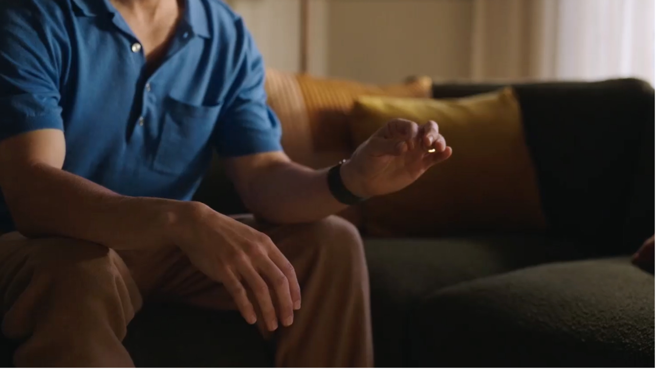 A person tapping their index finger and thumb together to select something on Apple&nbsp;Vision&nbsp;Pro.