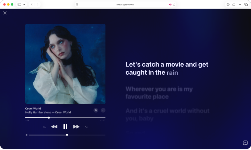 A song is playing in the Full Screen Player in Apple Music. Lyrics appear on the right, in time with the music. 