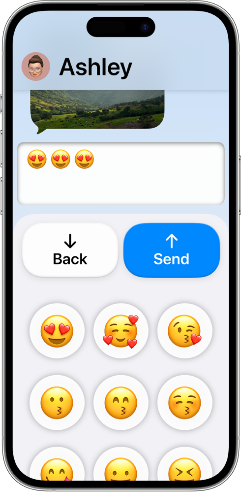 An iPhone in Assistive Access with the Messages app open. A message is being sent using an emoji-only keyboard.