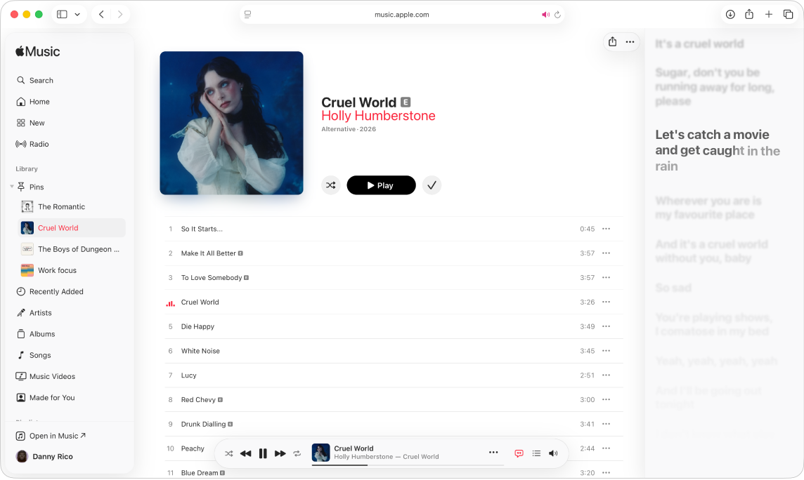 A song is playing in Apple Music. Lyrics appear on the right, in time with the music.