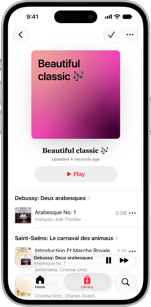 An iPhone showing a personal playlist in Apple Music Classical. At the top of the screen is album art, the name of the playlist, and a Play button. The MiniPlayer is near the bottom of the screen, and shows the track that’s currently playing. Below the MiniPlayer are the Home, Library, and Search buttons.