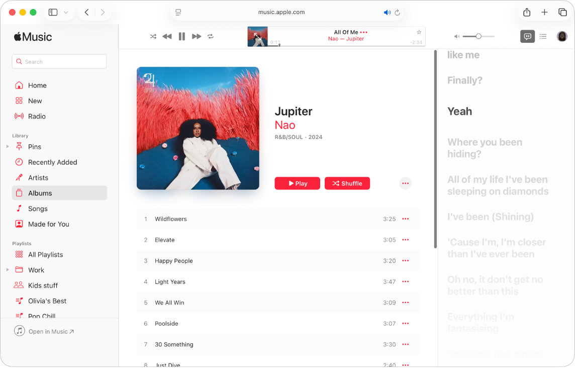 A song playing with lyrics on the right, which appear onscreen in time with the music.