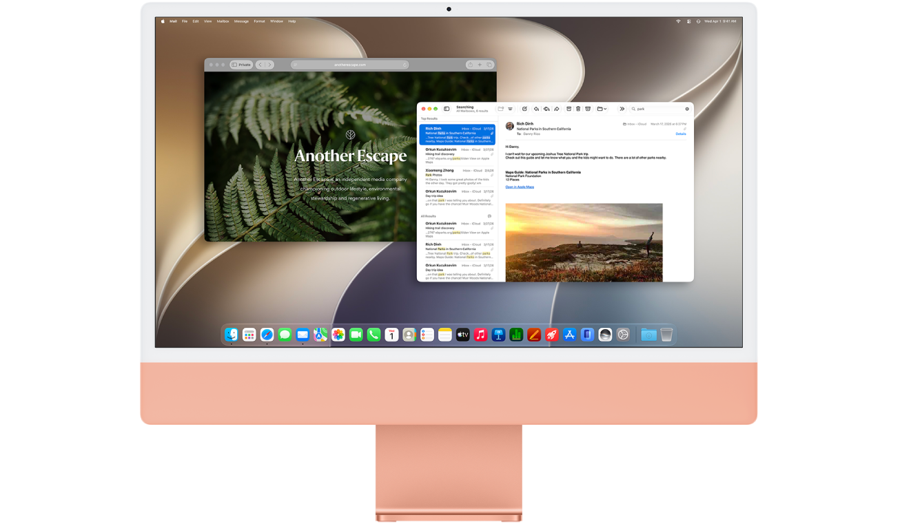 An iMac with a Mail app window and a Safari app window open.