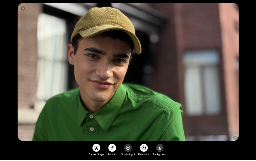 A FaceTime window showing a participant. Across the bottom of the window are video effect buttons: Center Stage, Portrait, Studio Light, Reactions, and Background.