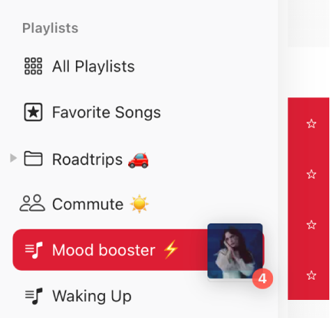 Songs being dragged to a playlist. The playlist is highlighted.