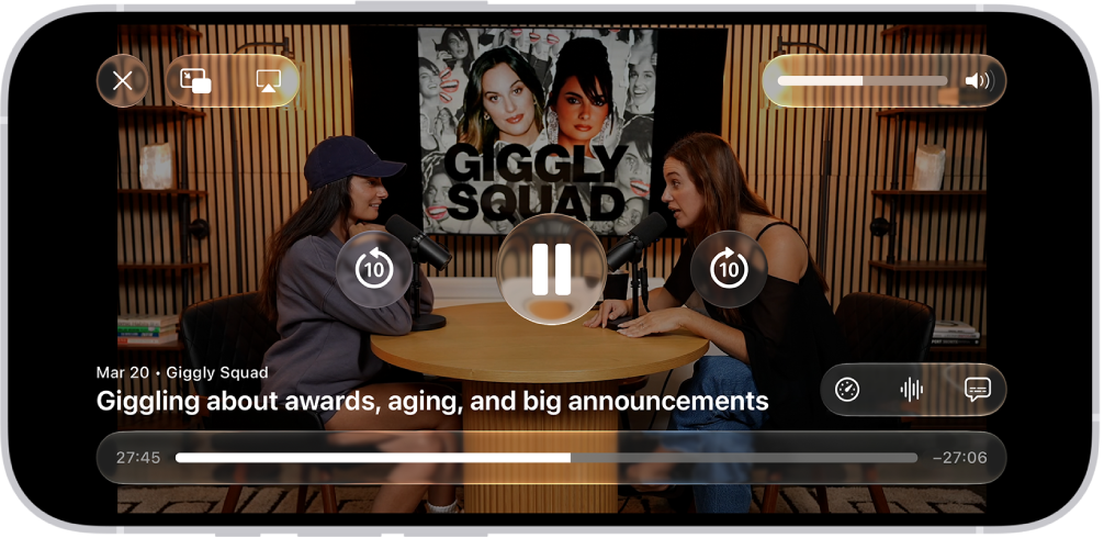 A video podcast in the Podcasts app expanded to full-screen video mode. At the top of the screen are display options and the volume control. The Skip Back, Pause, and Skip Forward buttons appear in the center of the screen. Episode details, the progress bar, and controls for playback speed, enhanced dialogue, and subtitles appear at the bottom of the screen.