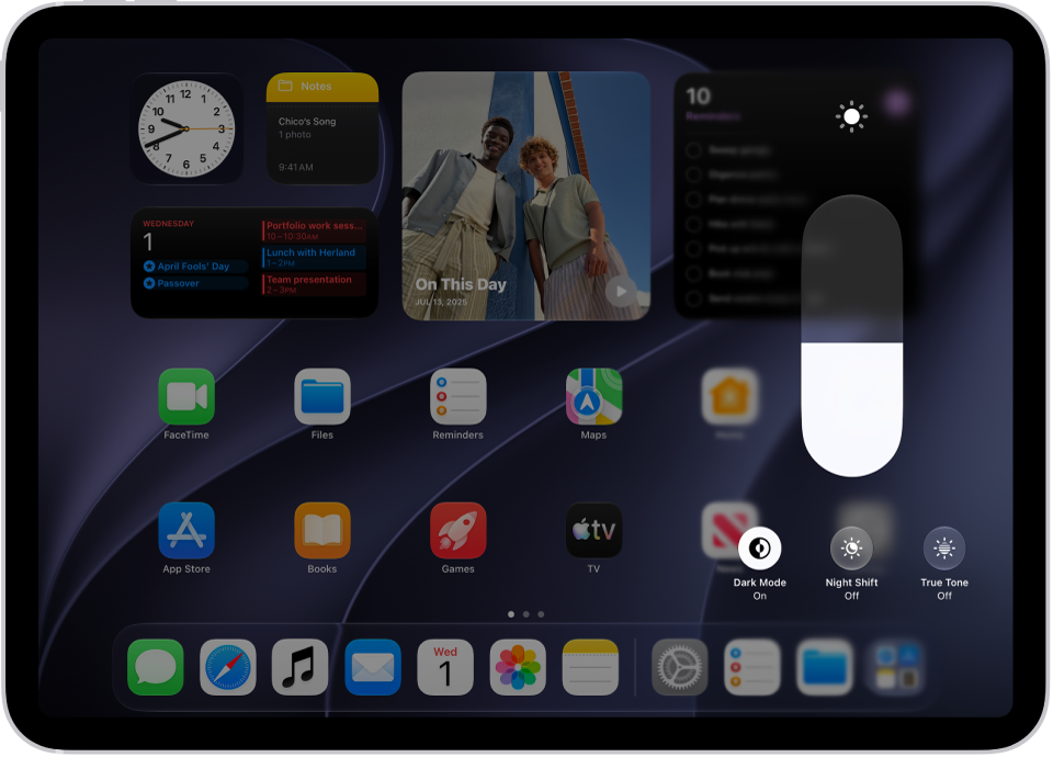 The iPad Home Screen with Dark&nbsp;Mode on.