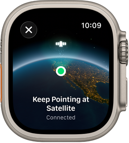 Una schermata con l’icona del satellite su una vista con curvatura della Terra, un indicatore di connessione verde e il testo “Continua a puntare verso il satellite per inviare la posizione”.
