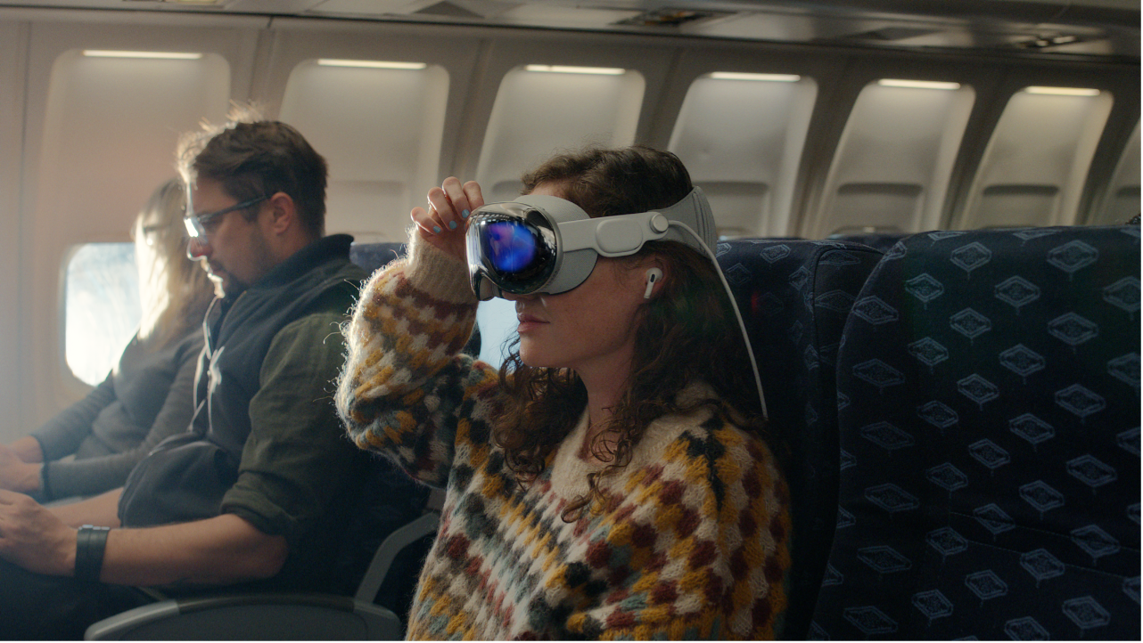A person wearing Apple&nbsp;Vision&nbsp;Pro with AirPods Pro in their ears.