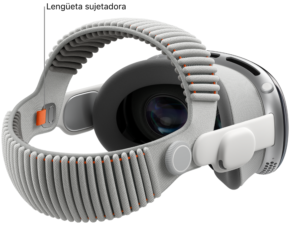 Un Apple&nbsp;Vision&nbsp;Pro con la banda doble tejida acoplada. Se muestra la lengüeta sujetadora de color naranja en la parte interior de la banda doble tejida.