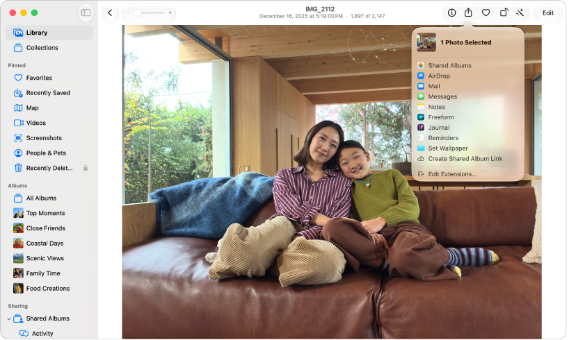 A photo is open in the Photos window. The Share menu is selected, showing a list of apps to use to share this photo.
