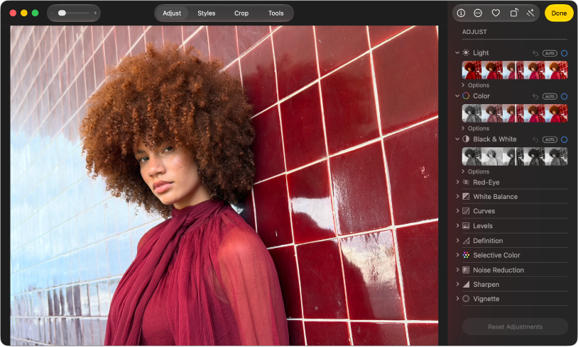 A photo in editing view, with Adjust selected in the toolbar and adjustment tools on the right.