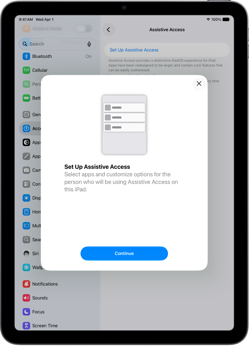 An iPad showing the Assistive Access setup screen with the Continue button at the bottom.