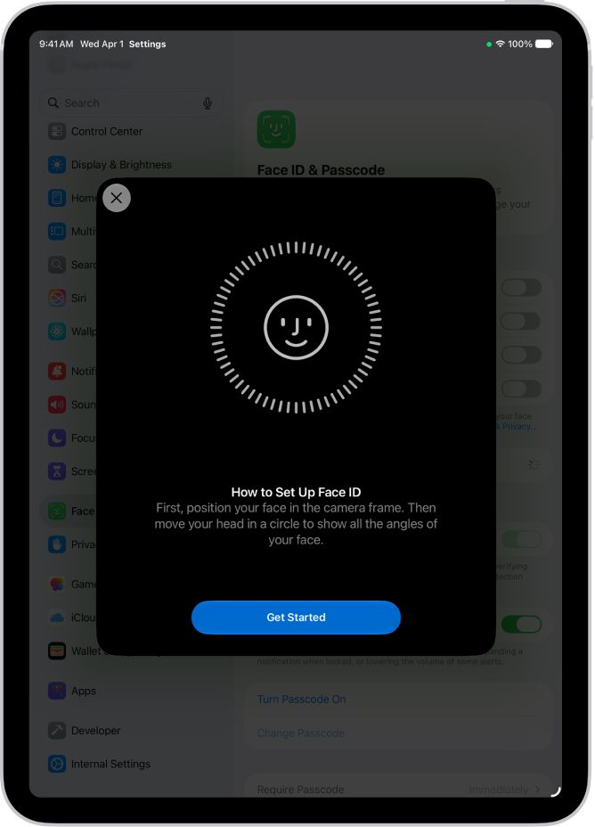 The Face ID recognition setup screen. A smiley face is showing on the screen, enclosed in a circle. Text below instructs the user to move their head slowly to complete the circle. A button for Get Started appears near the bottom of the screen.