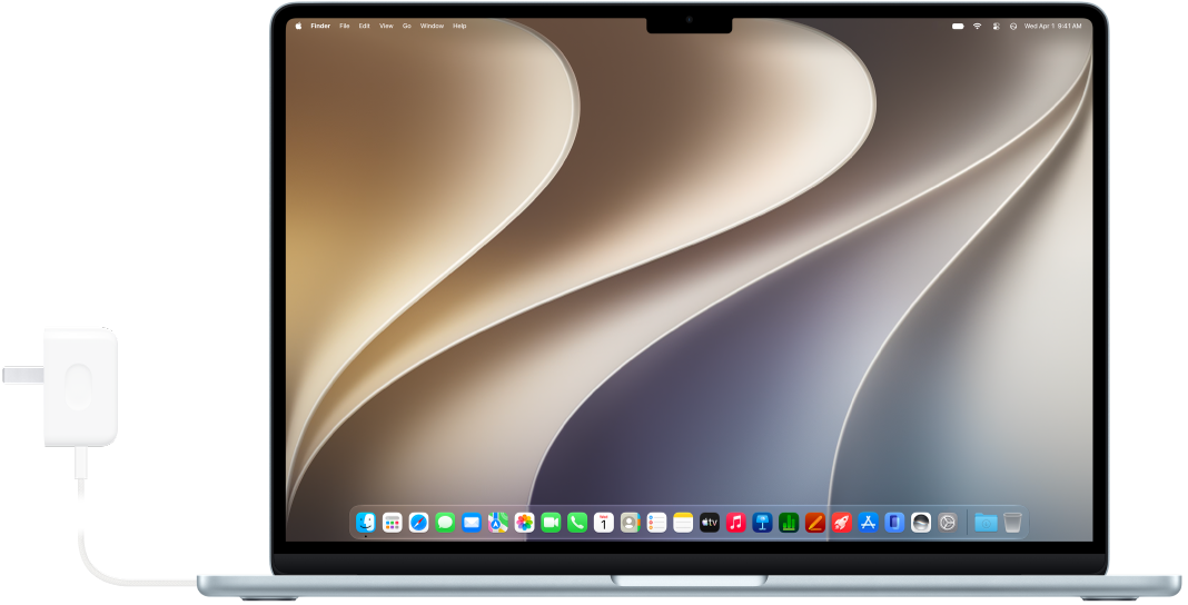 A MacBook Air with the power adapter attached.