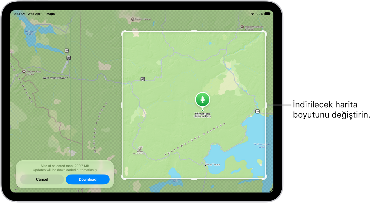 Bir milli parkın haritasını gösteren iPad. Park, tutamaçları olan bir dikdörtgenle çerçevelenir, bu dikdörtgenler indirilecek haritanın boyutunu değiştirmek için taşınabilir. Seçilen haritanın indirme boyutunu haritanın alt kısmında belirtilir. Vazgeç ve İndir düğmeleri ekranın en altında.
