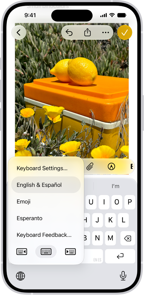 The Keyboard Settings menu is open, and shows three options: English (US), Emoji, and Keyboard Feedback. At the bottom of the menu, from left to right, are buttons for left-handed layout, default layout, and right-handed layout. The default layout button is selected.