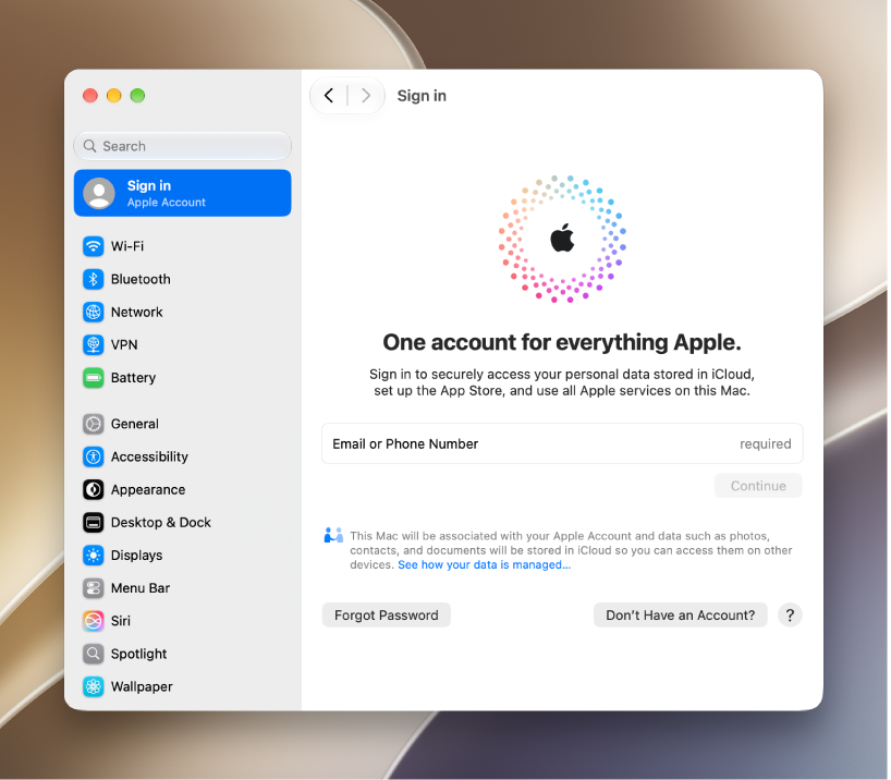 A Mac desktop with System Settings open, showing the Apple Account sign-in settings.