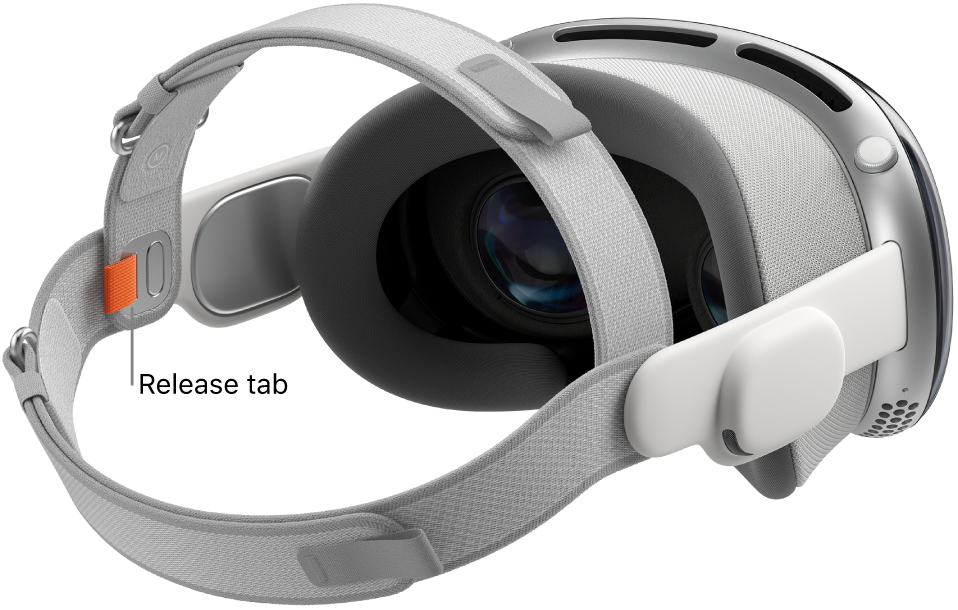Apple&nbsp;Vision&nbsp;Pro with the Dual Loop Band attached. An orange release tab is visible on the inside of the Dual Loop Band.