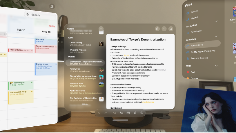 Multiple apps open on Apple&nbsp;Vision&nbsp;Pro, arranged in front of and around the user.