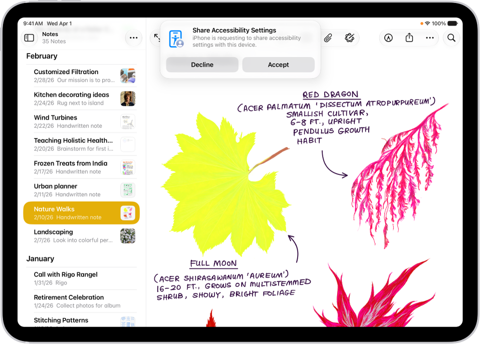 Un iPad affichant une notification indiquant que l’iPhone de Daniel demande à partager ses réglages d’accessibilité.