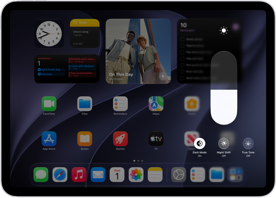 The iPad Home Screen with Dark&nbsp;Mode on.