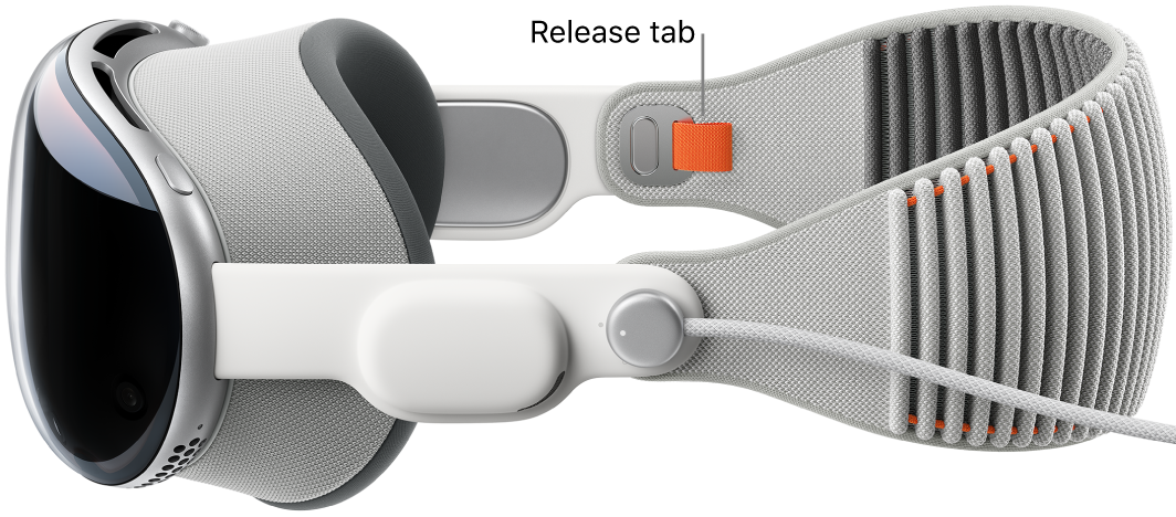 Apple&nbsp;Vision&nbsp;Pro with the Solo Knit Band attached. An orange release tab is visible on the inside of the Solo Knit Band.