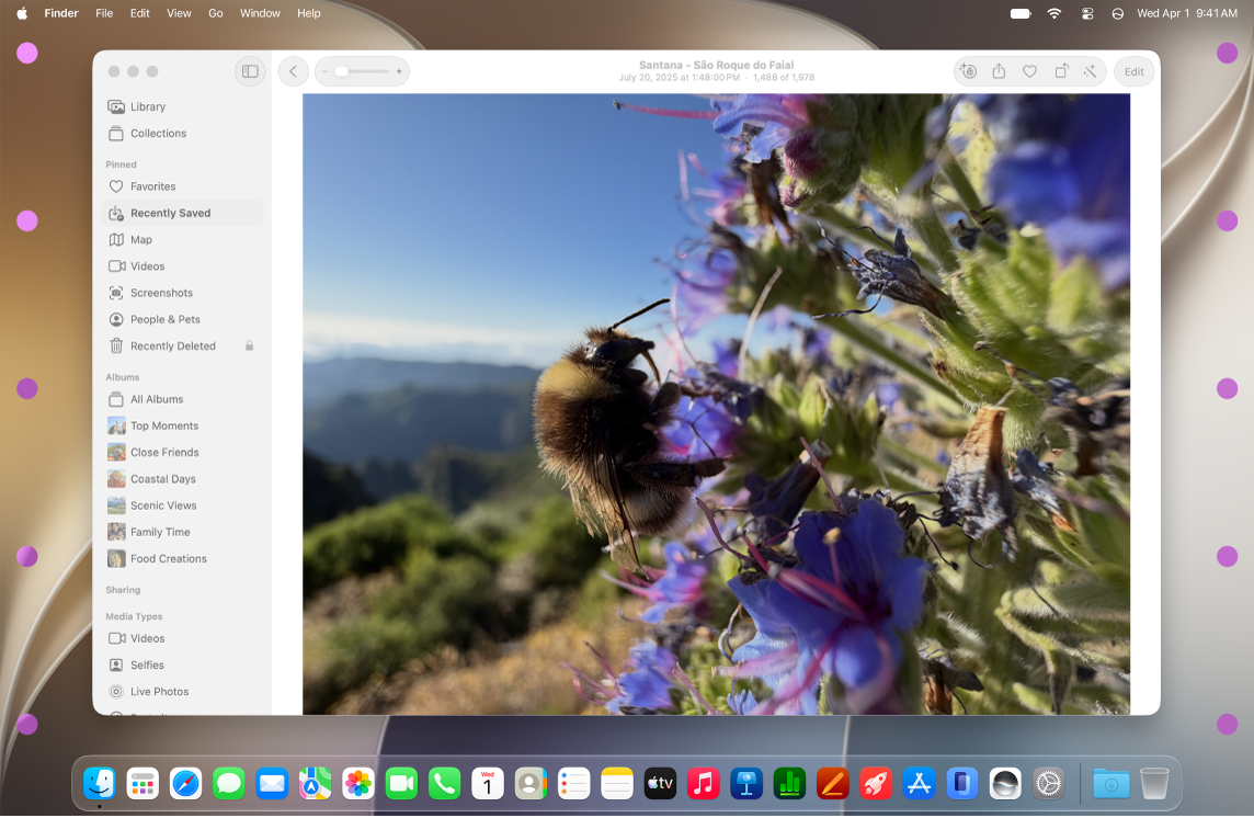 The Notes app is open on the desktop, and dots appear on either side of the desktop.