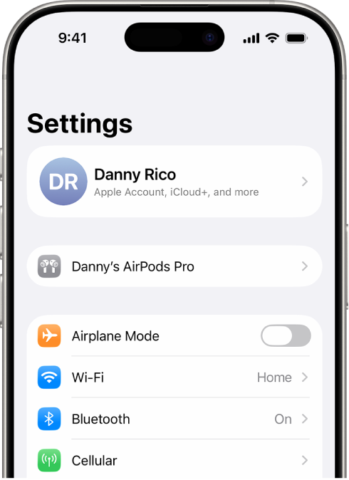 The Settings app on iPhone, showing a user’s connected AirPods listed at the top of the screen.