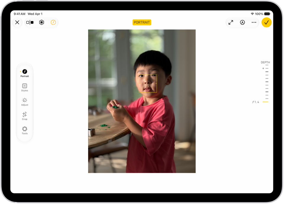 The Edit screen of a Portrait mode photo. A portrait photo is in the center of the screen. On the right side of the screen is a slider to adjust the Depth Adjustment setting. On the left side of the screen are the Portrait, Adjust, Filters, and Crop buttons. The Portrait button is selected.