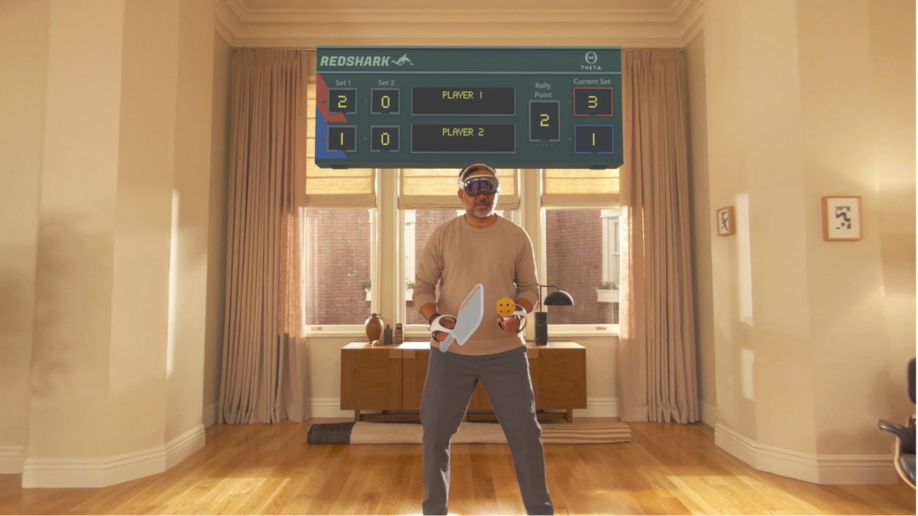 A person playing a game in Apple Arcade on Apple&nbsp;Vision&nbsp;Pro, using a connected controller.