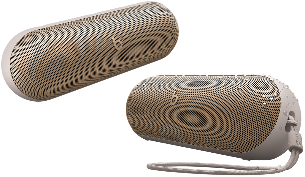 Two champagne Beats Pill speakers