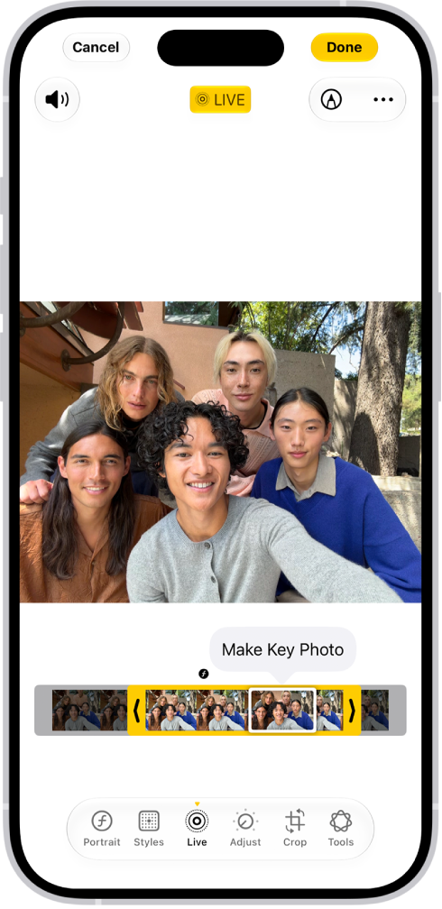 A Live Photo is open in the Photos app. Beneath the photo is the frame viewer with the Make Key Photo button active. On either end of the frame viewer are two arrows that allow you to trim the Live Photo. At the bottom of the screen are the Live, Adjust, Filters, and Crop buttons. The Live button is selected.